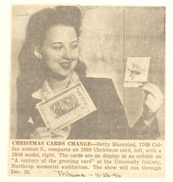 An old newspaper clipping of a person holding up a greeting card