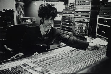 Prince in a recording studio booth