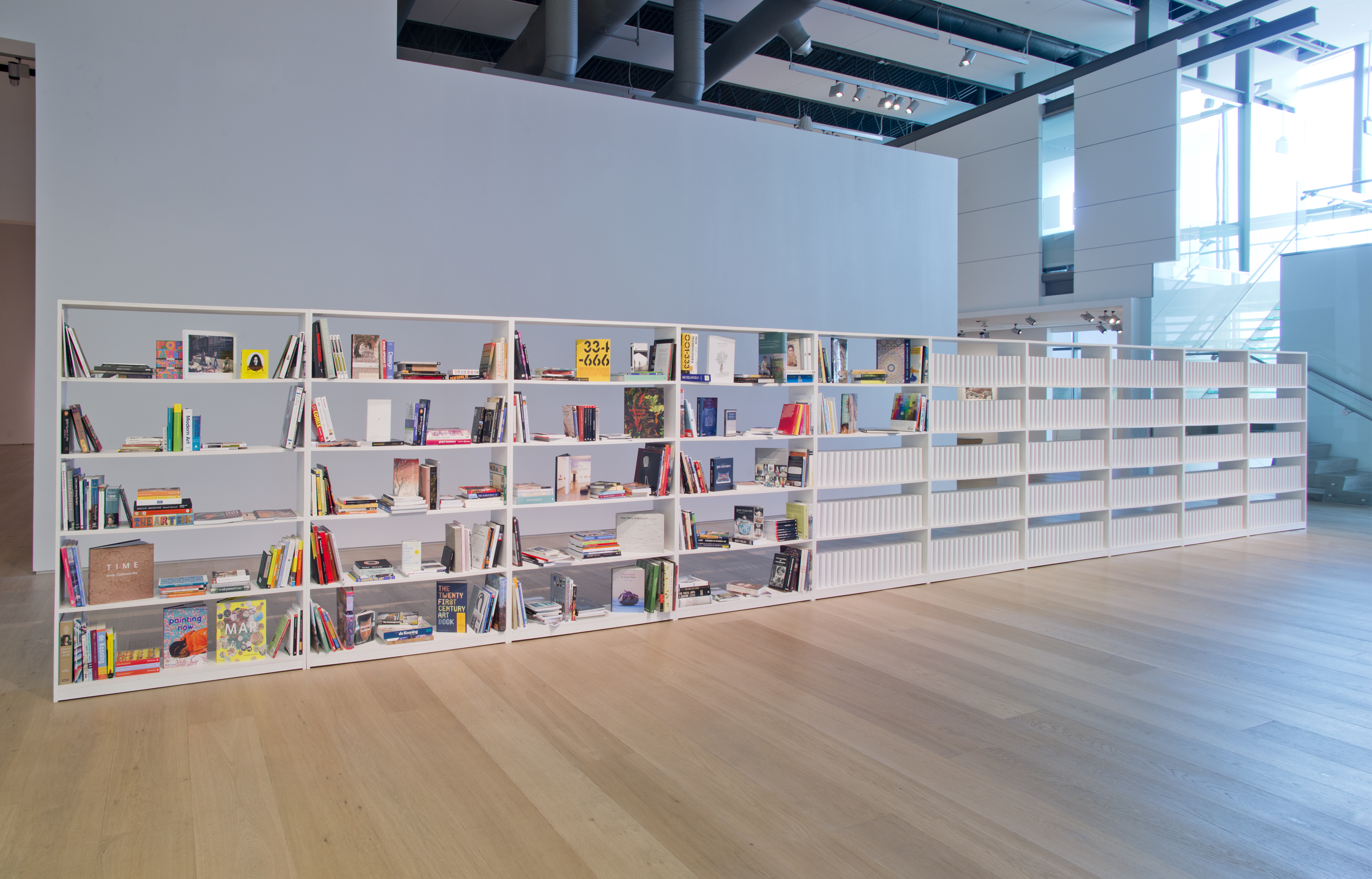 White shelves with books on them