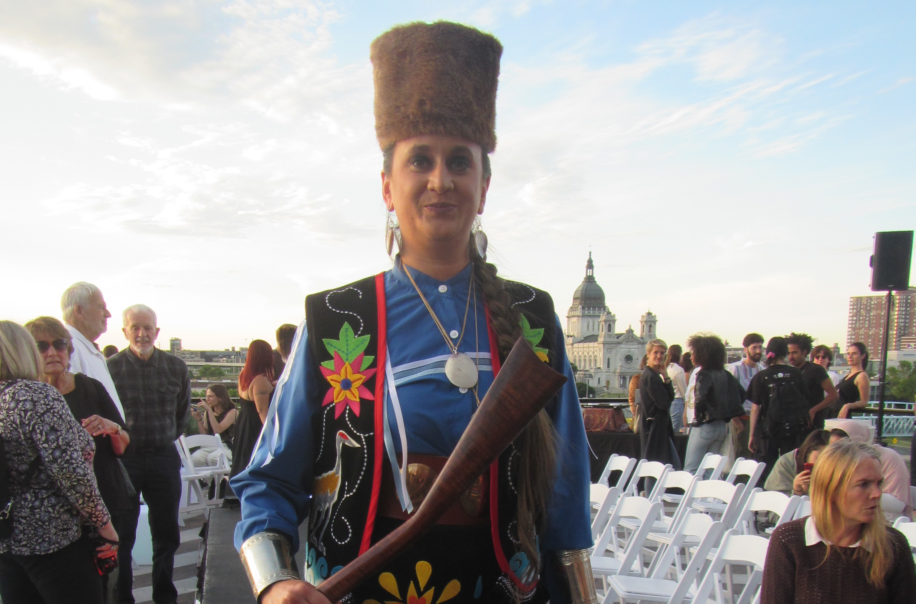 A person wearing black and blue garb