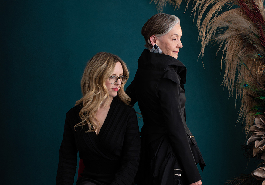 Two women in black coats