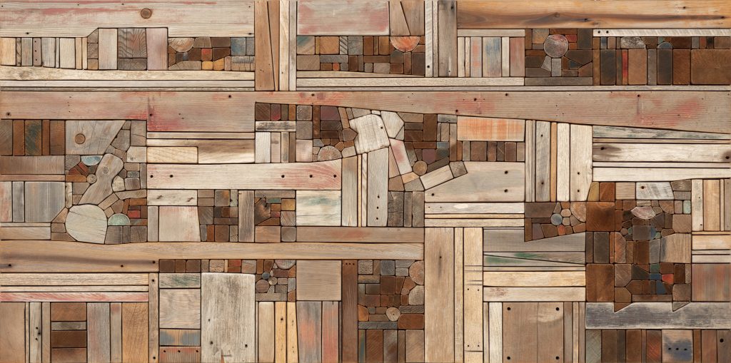 An image of Morrison's "Wood Collage: Landscape," which includes pieces of driftwood of various colors, sizes, and shapes placed together into a single frame.