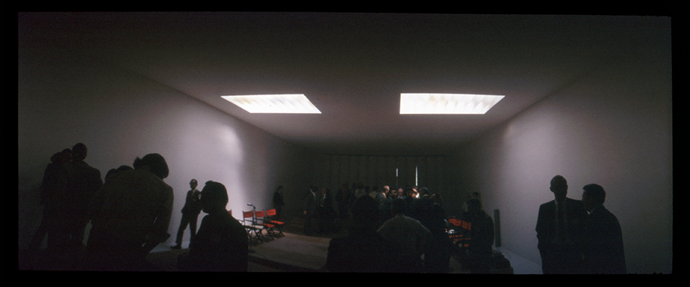 A group of people in a dark room