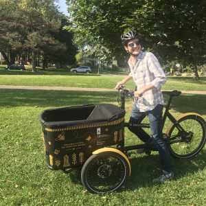 Intern Luke Myers with Pollinator Bike Cart