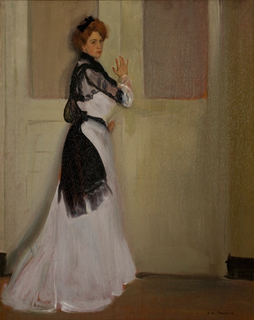 person in white dress standing in front of a door