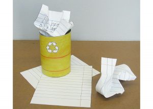 A paper yellow recycling barrel