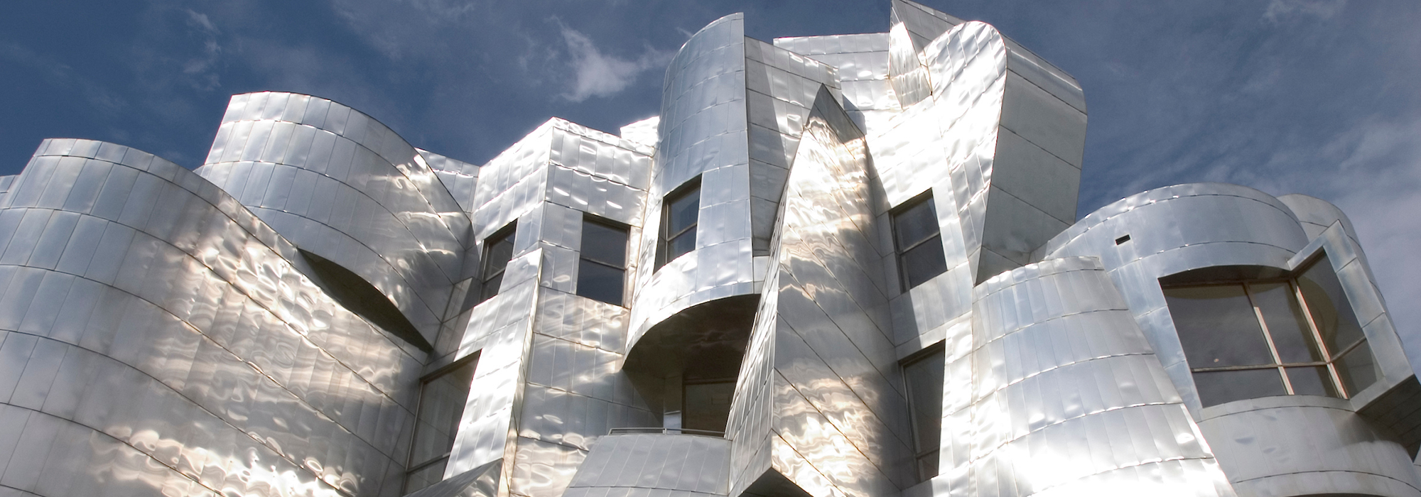 the exterior of Weisman against a cloudy blue sky