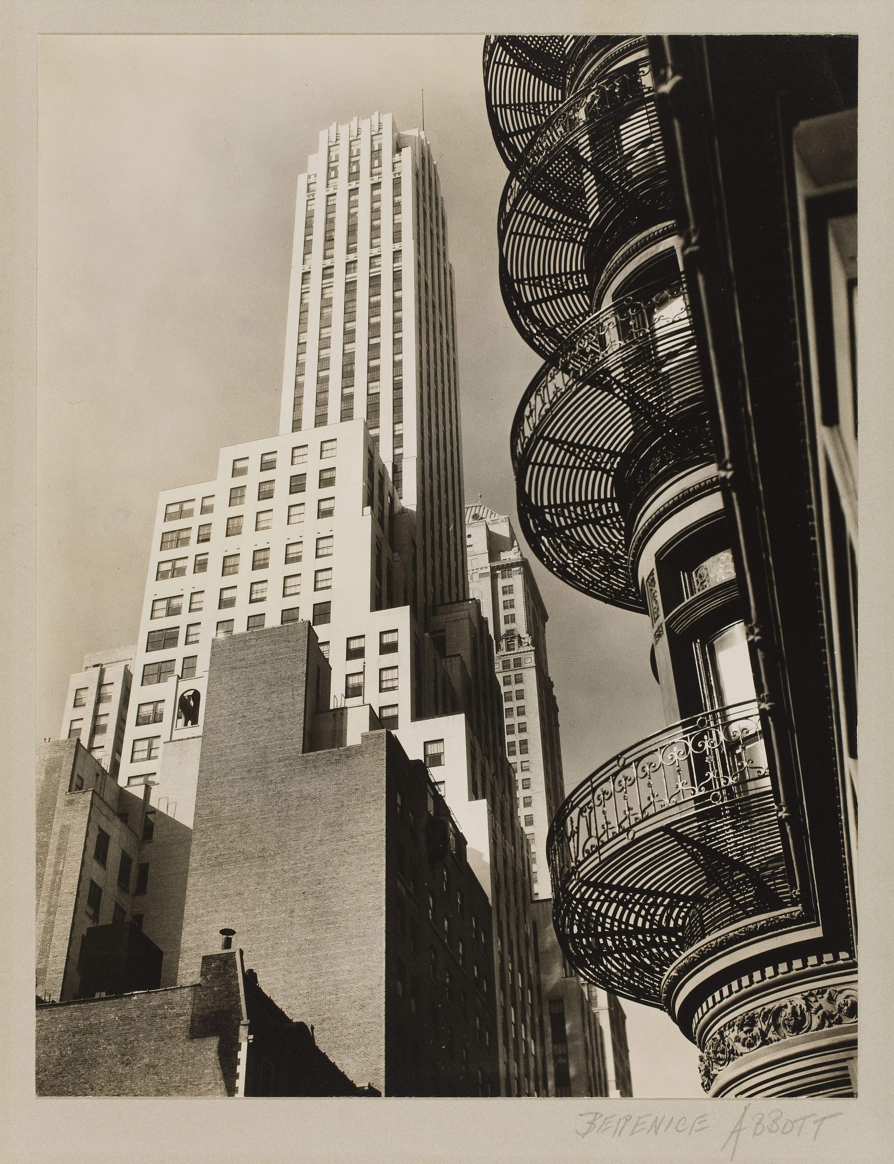 old photograph of skyscraper and metal building accents