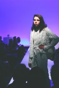 A person posing on the runway