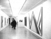 A hallway with art on the walls
