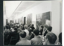 A crowd of people in a hallway