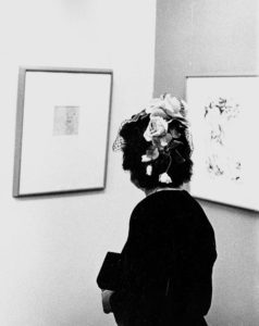 A person looking at artwork