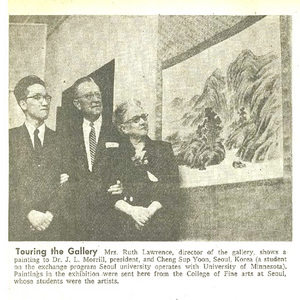 An old newspaper clipping of 3 people looking at Korean art