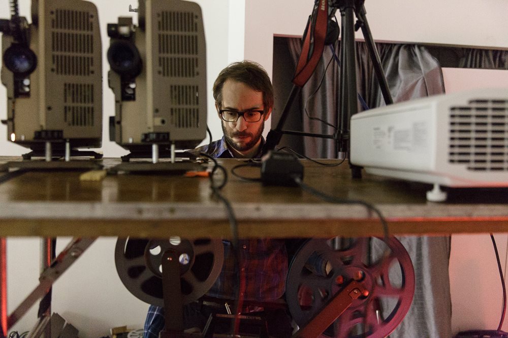 A person working with film equipment