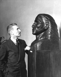 John Rood and a sculpture