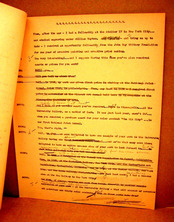 A yellowish paper full of text, some scratched out