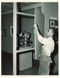 person installing a wall panel