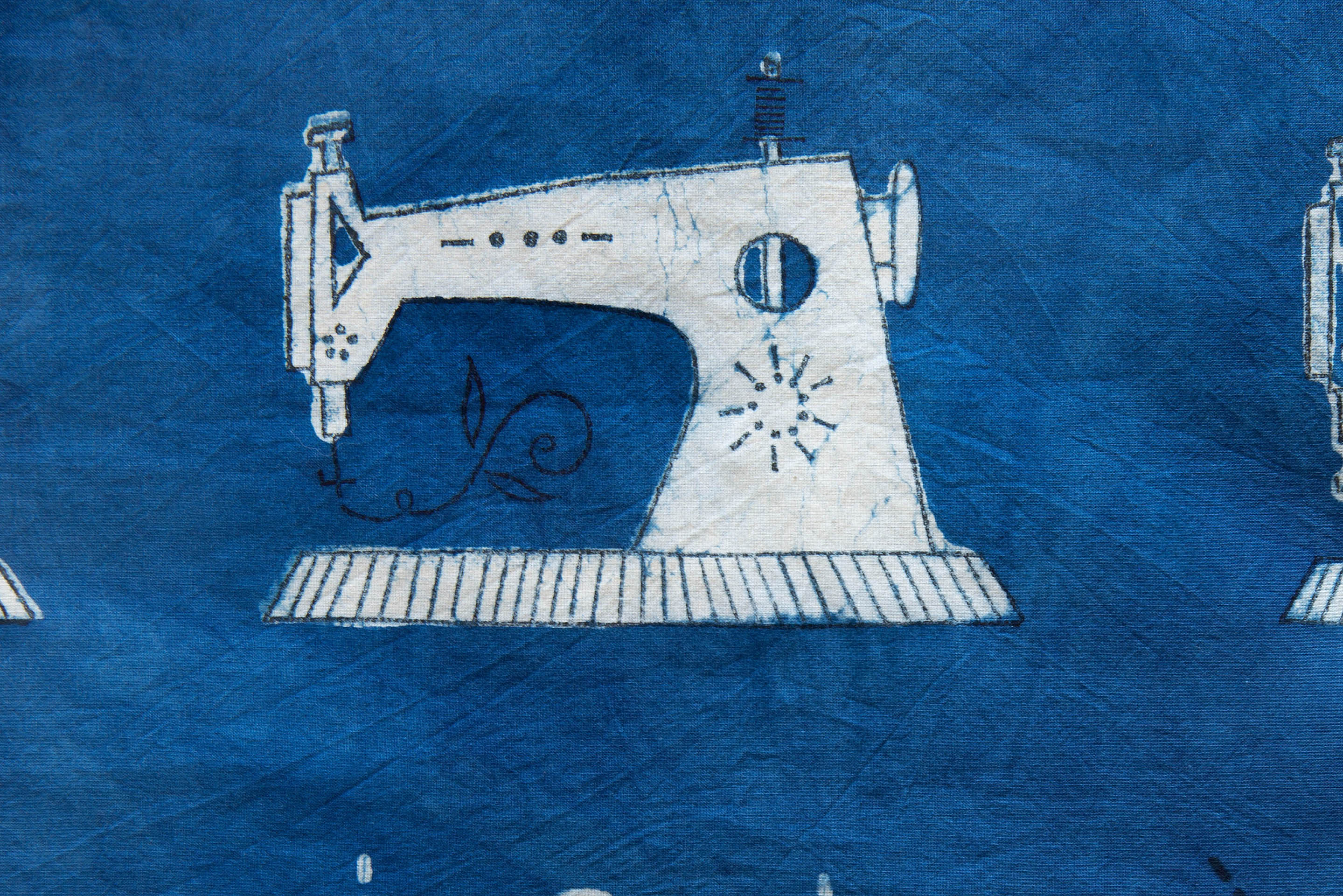 sewing machine on blue fabric