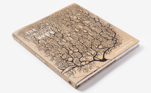 a brown book with a tree on the cover