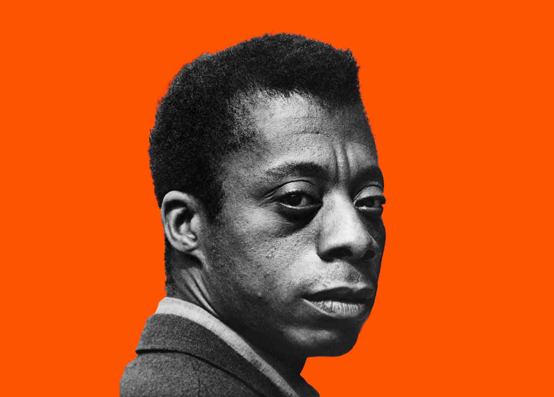 A Black male looks solemnly into the camera (black and white image). The figure is cutout against a solid orange background. 