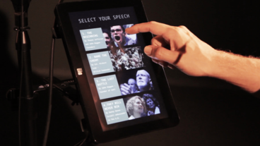 A person selecting a speech on a tablet