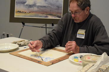 Artist, Jim Mondloch, painting at the watercolor workshop. Photo by Tara Sullivan.