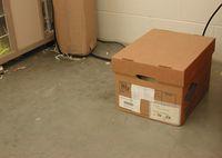 A cardboard box on the floor