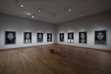 portraits on display in a gallery