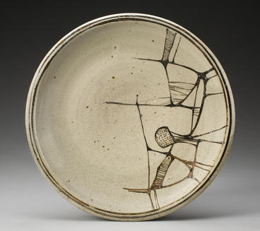 ceramic plate with cracked designs on one half