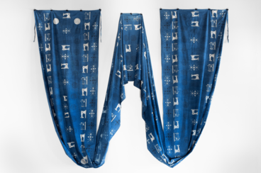 blue fabric with sewing machines printed on it
