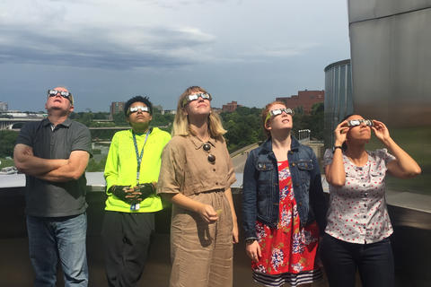 5 people wearing goggles looking up