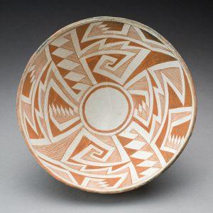 A white and brown piece of pottery