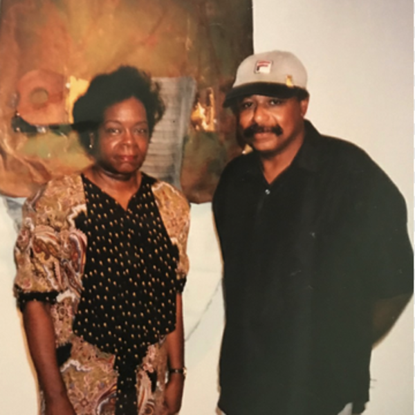 Rose and Melvin Smith standing in front of artpiece